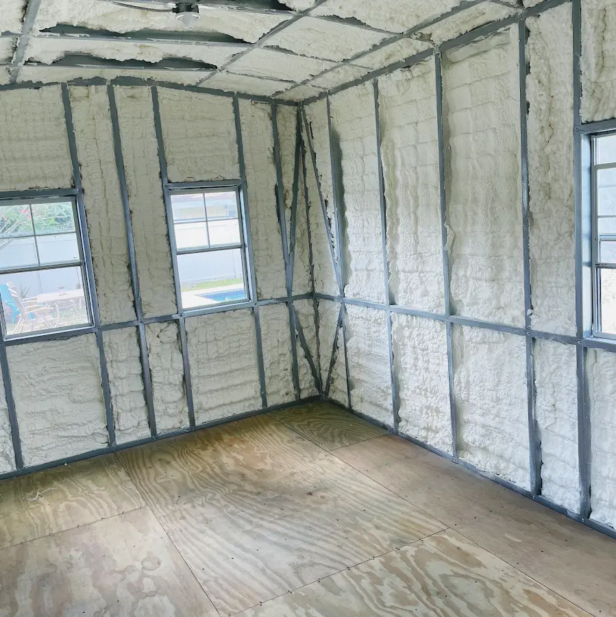 Closed-cell spray foam insulation applied to wall cavities in a residential project in Zachary